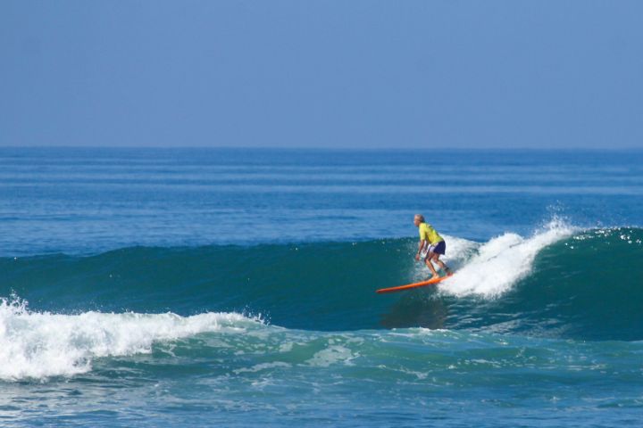 Dennis W. Smith Surfing Bali on Longboard